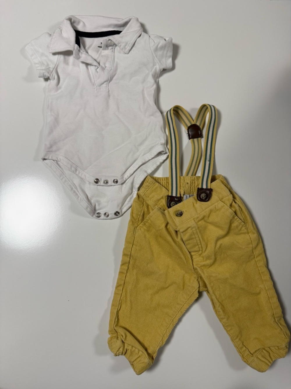 White Polo Onesie with Mustard Yellow Corduroy Pants and Striped Suspenders